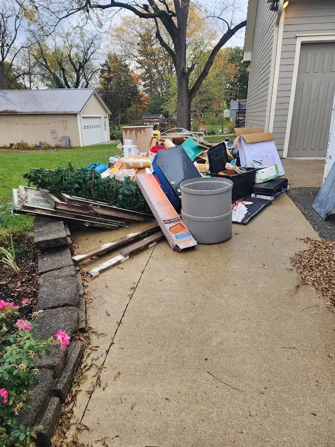 Dumpster being loaded with debris for 3 Yard Dumpster Rental in Las Cruces